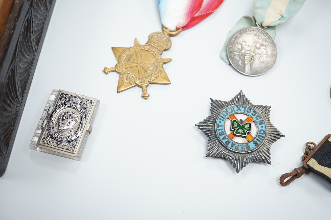 A quantity of assorted medals, an Essex crystal button, badges and ephemera
